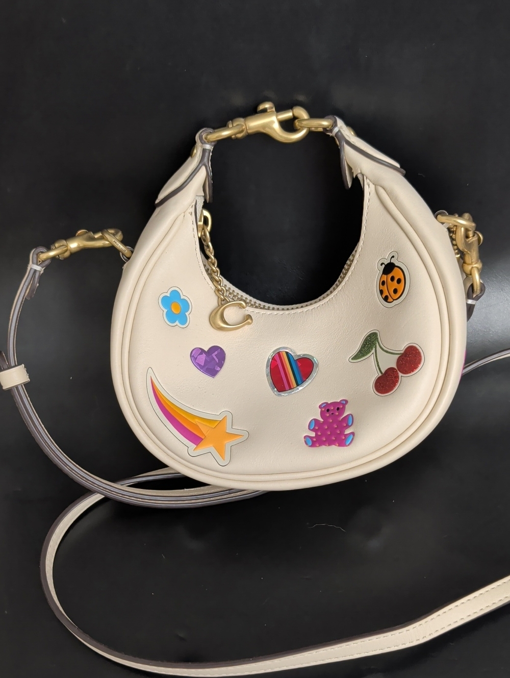 Cream Mini Crescent Crossbody Bag with Playful Patch Motifs